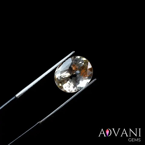 5.05ct Certified Oval Cut Yellowish-Orange Topaz from Pakistan